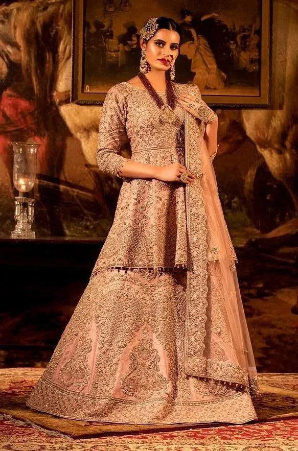 Dusty pink Peplum Lehenga set with Net dupatta.